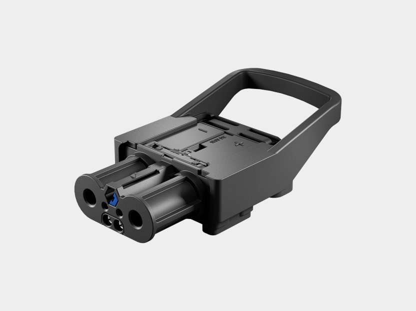 Schaltbau LV series high-power DC charging connector in black, featuring an integrated handle and high-current contact interface